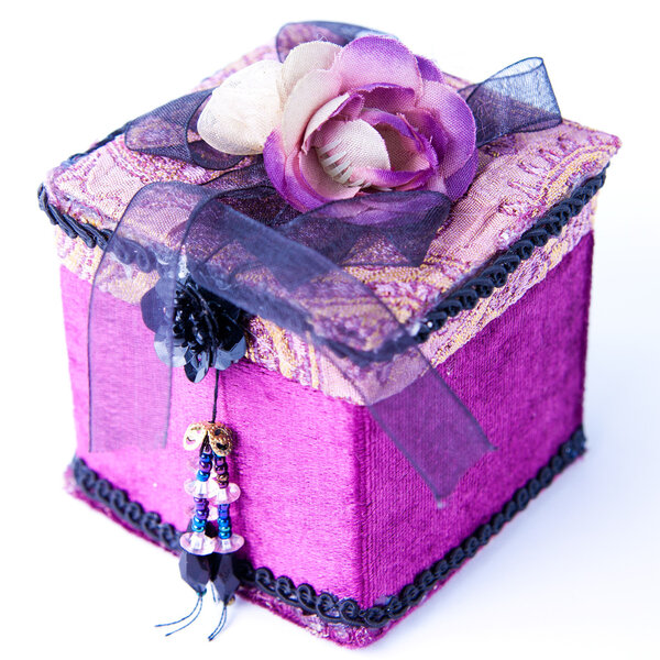 Purple gift box with a rose isolated.