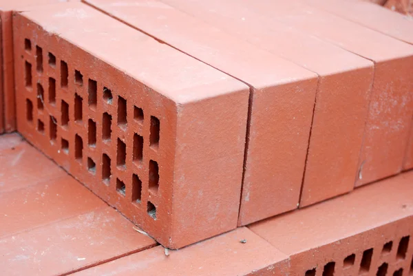 Perforated brick a stack of bricks as a background in close-up Stock Image
