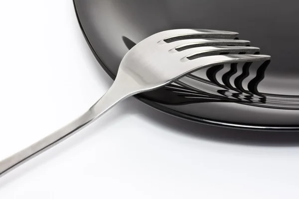 stock image Black plate with fork