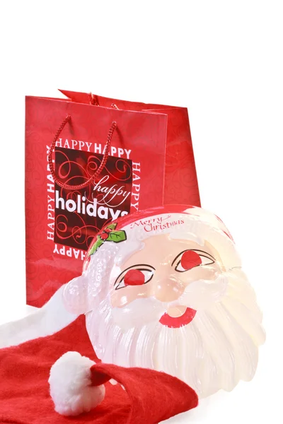 Shopping natalizio con maschera e berretto di Babbo Natale — Foto Stock