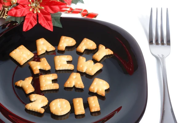 stock image Black plate with cookies, fork and new year decoration