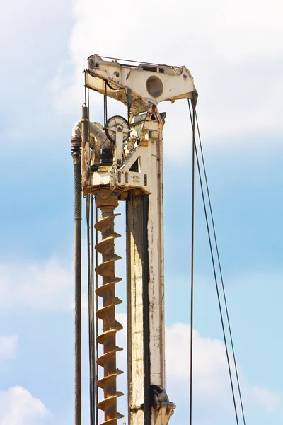 stock image Auger part over blue sky with clouds