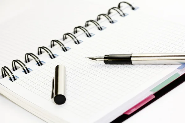 Paper notebook with fountain pen on it — Stock Photo, Image
