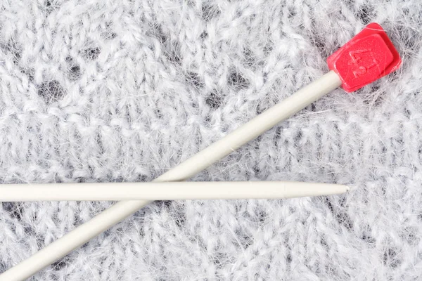 Woolen mohair knitted texture with knitting needles — Stock Photo, Image