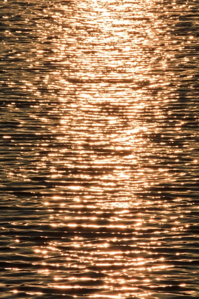 stock image Evening sun patches of light on the lake ripple surface