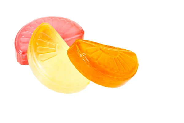 Fruit drop lemon, orange and grapefruit sections isolated on white — Stock Photo, Image