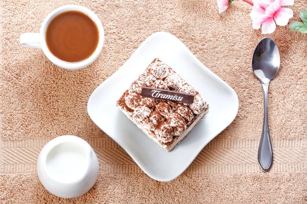 Portion of tiramisu dessert and a cup of coffee — Stock Photo, Image