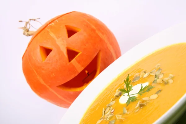 Pumpkin soup and Jack-o'-lantern — Stock Photo, Image