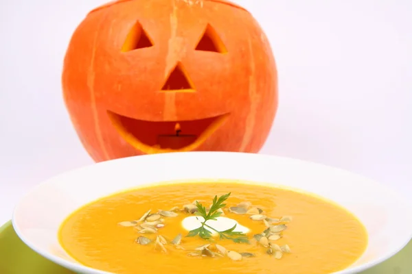 Pumpkin soup and Jack-o-lantern — Stock Photo, Image