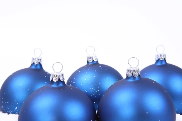 Christmas balls on snow Stock Image