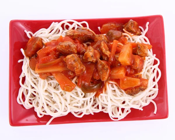 stock image Chinese food - sweet and sour chicken with chow mein noodles