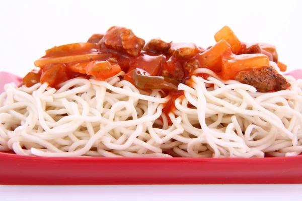 stock image Chinese food - sweet and sour chicken with chow mein noodles