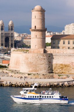Medieval Fortress and cathedral on the waterfront in Marseille France clipart