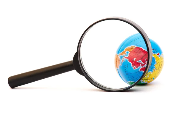 stock image Globe under a magnifier