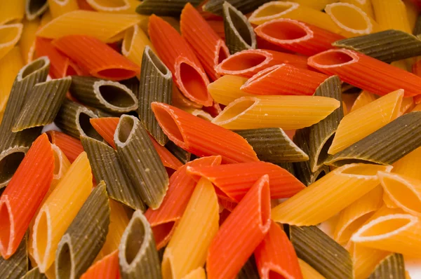 Närbild skott av rå italiensk pasta — Stockfoto