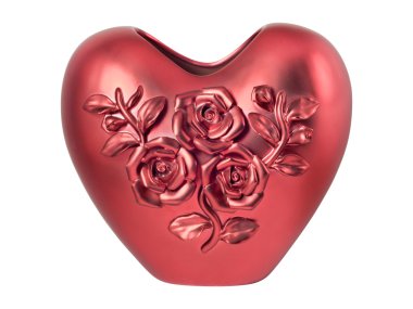 Kırmızı kalp şeklinde vazoda üç gül ile dekore edilmiştir.