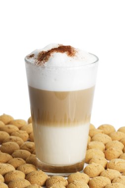 Latte macchiato between a lot of amarettini clipart