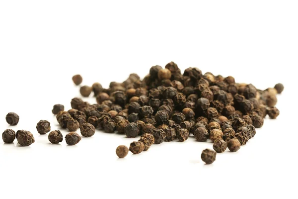 Lot of black peppercorns — Stock Photo, Image