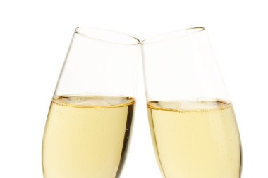 Closeup of two aslope glasses with champagne clipart