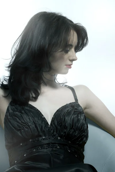 Beautiful young woman in black dress — Stock Photo, Image