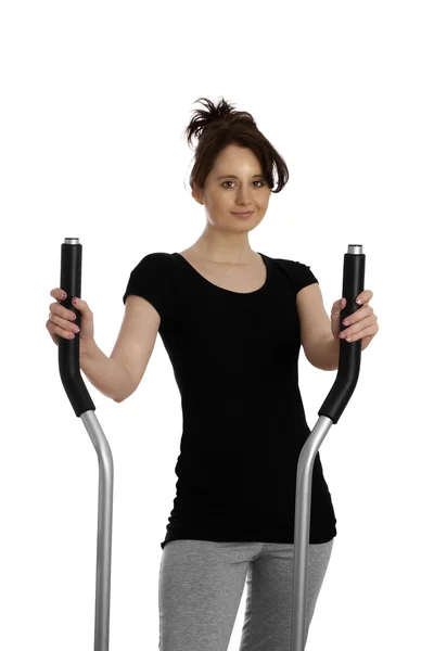 Young woman on stepping machine — Stock Photo, Image