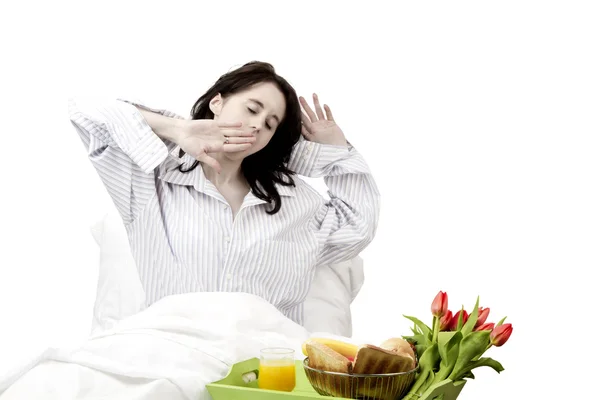 Young woman yawning before breakfast — Stock Photo, Image
