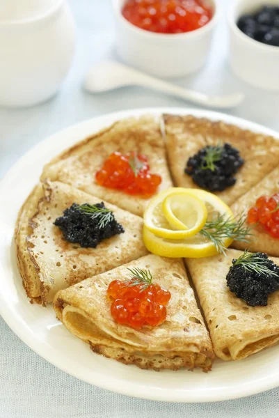 stock image Traditional Russian pancakes with red and black caviar