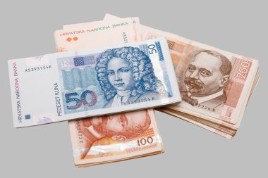 Croatian Kuna banknotes isolated on gray clipart