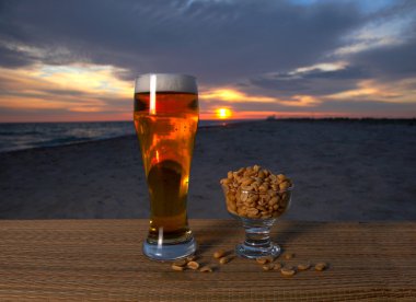 Fresh glass of pils beer with froth and condensed water pearls & clipart