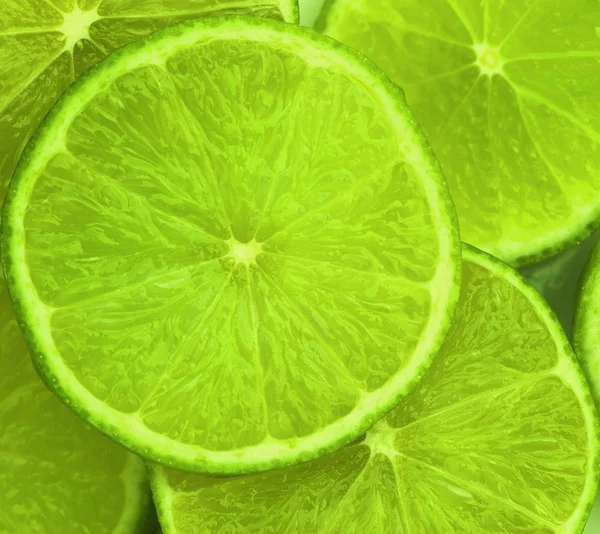 Lime slices abstract food background — Stock Photo, Image