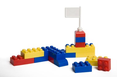 Plastic toy blocks on white background. clipart