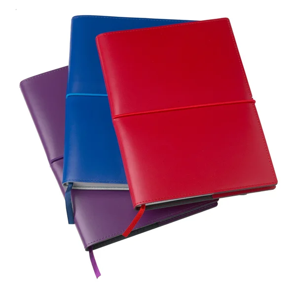 Gesloten gekleurd leder-laptops geïsoleerd op wit — Stockfoto