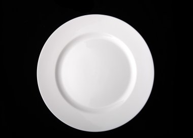 Blank white dinner plate isolated on the black background with clipping path. clipart