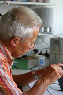 Older man working clipart