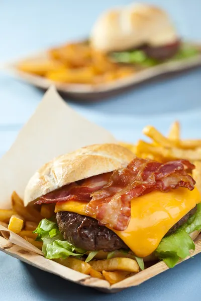 Cheeseburger with bacon and fries — Stock Photo, Image
