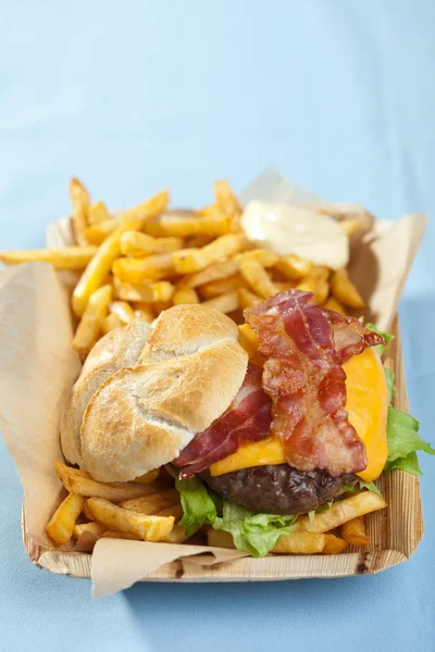Cheeseburger with bacon and fries — Stock Photo, Image