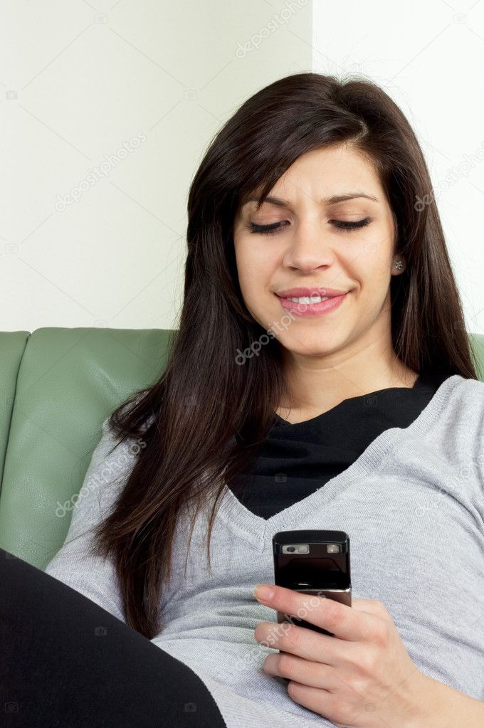 Beautiful girl reading text message