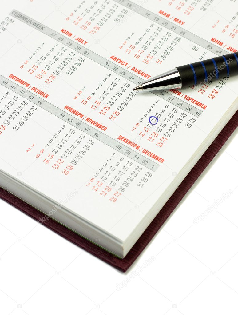 Calendar and pen over white background. September 11 checked