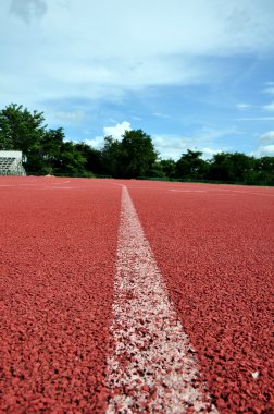 Running lane with blue sky clipart