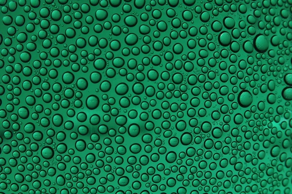 Vatten bubbla i gröna tapeter — Stockfoto