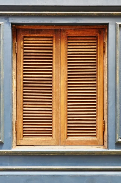 Wooden window as blue wall — Stock Photo, Image