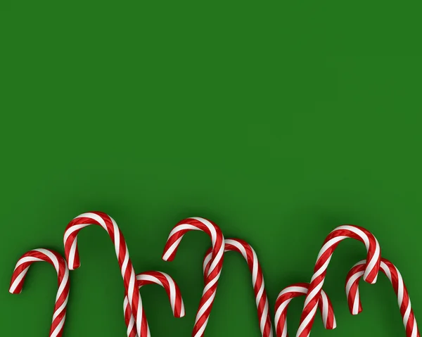 Рождественские конфеты на зеленом фоне — стоковое фото