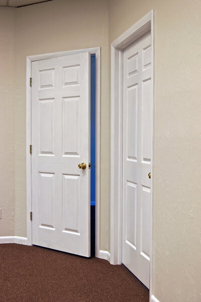 Two white doors one open
