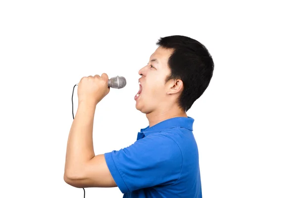 Man with a microphone singing — Stock Photo, Image