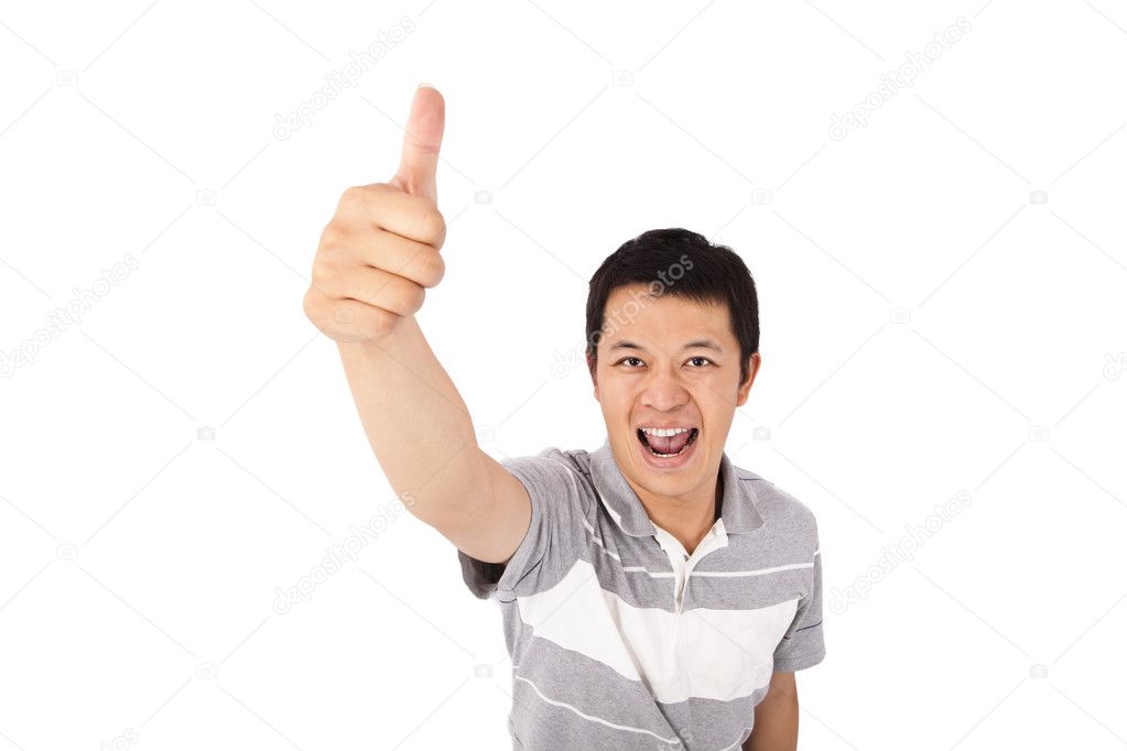 Young man gives his thumbs up