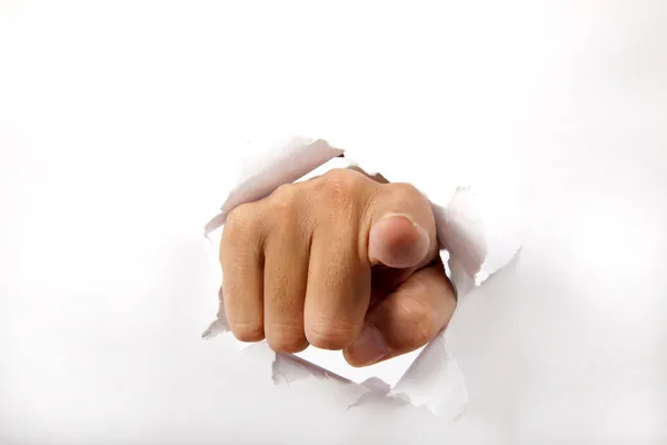 Hand sönder genom vitboken — Stockfoto