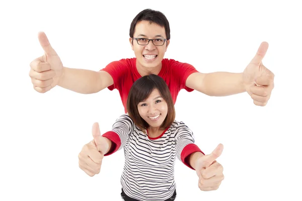Fiatal pár a hüvelykujjával felfelé — Stock Fotó
