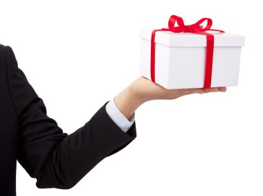 Businessman holding and offer a gift