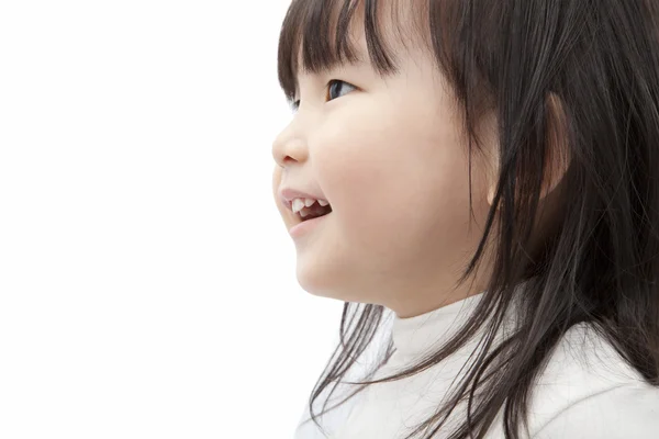 Bella asiatica piccola ragazza guarda e sorride — Foto Stock