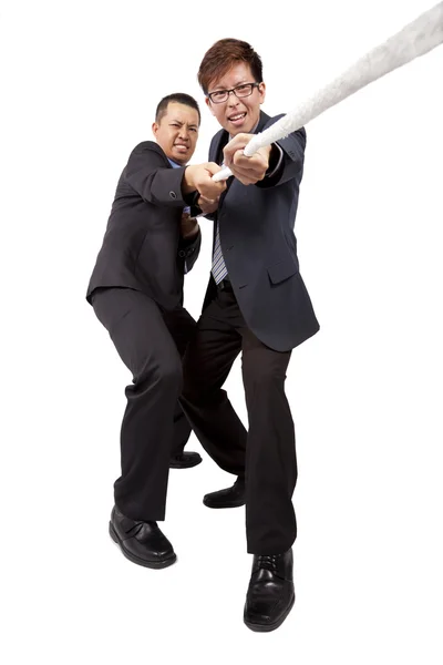 Two businessman work together and playing tug of war — Stock Photo, Image